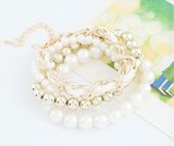 A Gold Pearl Bracelet Set