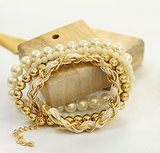 A Gold Pearl Bracelet Set